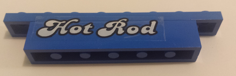 Stickered Assembly 8 x 1 x 1 1/3 with White 'Hot Rod' Pattern Model Left Side (Sticker) - Set 5541 - 1 Brick 1 x 6, 1 Plate 1 x 8