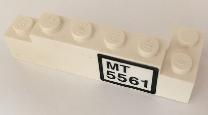 Stickered Assembly 6 x 2 x 1 1/3 with Black 'MT 5561' Pattern (Sticker) - Set 5561 - 1 Brick 1 x 4, 1 Brick 2 x 2 Corner, 1 Plate 1 x 4
