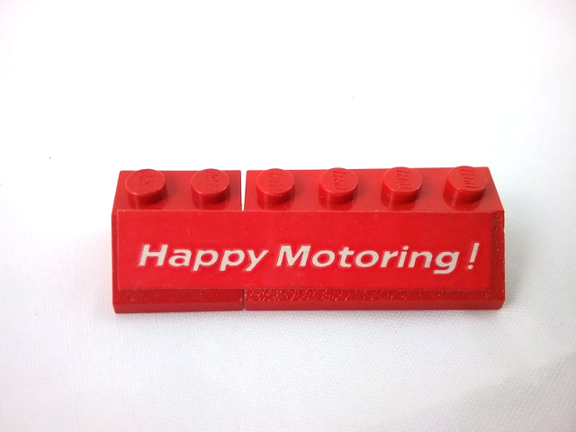 Stickered Assembly 6 x 2 x 1 with 'Happy Motoring !' Pattern Model Right Side (Sticker) - Set  554 - 1 Slope 45 2 x 2, 1 Slope 45 2 x 4
