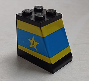 Stickered Assembly 3 x 2 x 2 1/3 with Blue and Yellow Stripes, Star and Letter J Pattern (Sticker) - Set 1554 - 2 Brick 1 x 2, 1 Plate 2 x 2, 1 Slope 65 2 x 2 x 2