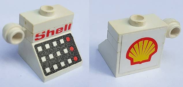 Stickered Assembly 2 x 2 x 1 2/3 with Red 'Shell' and Logo Pattern Model Left Side (Stickers) - Set 6371 - 1 Slope 45 2 x 2 with 12 Buttons and 3 Red Lamps on Black Background Pattern, 1 Plate 1 x 1, 1 Plate, Modified 1 x 1 with Light Attachment - Thin Ring, 1 Plate, Modified 1 x 2 with 1 Stud without Groove (Jumper)