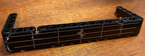 Stickered Assembly 15 x 5 x 2 with Silver Ferrari Logo on Grille Pattern (Sticker) - Set 8145 - 1 Technic, Liftarm Thick 1 x 9, 1 Technic, Liftarm Thick 1 x 15, 2 Technic, Liftarm, Modified Bent Thick L-Shape 3 x 5, 6 Technic, Pin with Friction Ridges