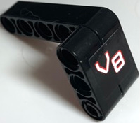 Stickered Assembly 5 x 2 x 3 with Red and White 'V8' Pattern Model Left Side (Sticker) - Set 8682 - 1 Technic, Liftarm Thick 1 x 3, 1 Technic, Liftarm, Modified Bent Thick L-Shape 3 x 5, 1 Technic, Pin with Short Friction Ridges