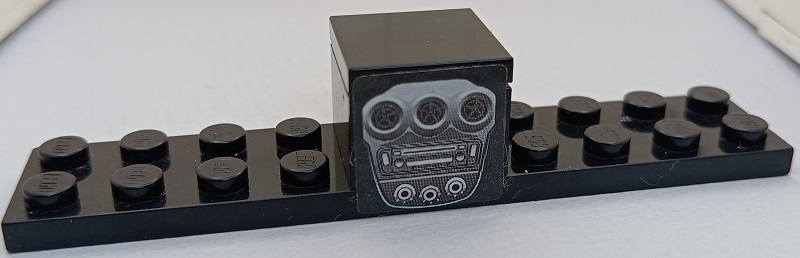 Stickered Assembly 10 x 2 x 1 2/3 with Ferrari Centre Console with Radio, Air Vents and Dials Pattern (Sticker) - Set 8671 - 1 Plate 2 x 10, 1 Brick 2 x 2, 1 Tile 2 x 2