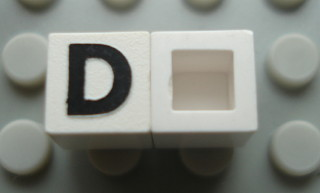 Modulex, Tile 1 x 1 with Black 'D' Pattern (no internal lining)