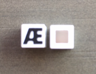 Modulex, Tile 1 x 1 with Black 'Æ' Pattern (no internal lining)