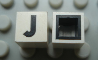 Modulex, Tile 1 x 1 with Black 'J' Pattern (with black lining on sides only)