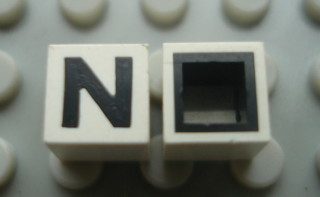 Modulex, Tile 1 x 1 with Black 'N' Pattern (with black lining on sides only)