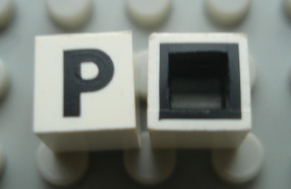 Modulex, Tile 1 x 1 with Black 'P' Pattern (with black lining on sides only)