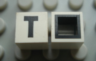 Modulex, Tile 1 x 1 with Black 'T' Pattern (with black lining on sides only)