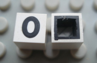 Modulex, Tile 1 x 1 with Black '0' Pattern (with black lining on sides only)