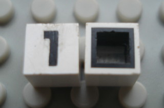 Modulex, Tile 1 x 1 with Black '1' Pattern (with black lining on sides only)