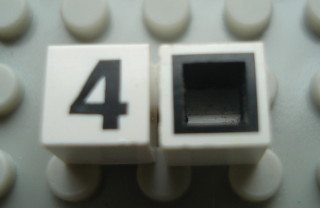 Modulex, Tile 1 x 1 with Black '4' Pattern (with black lining on sides only)