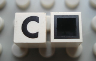Modulex, Tile 1 x 1 with Black 'C' Pattern (with black lining on top and sides)