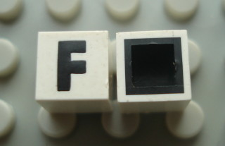 Modulex, Tile 1 x 1 with Black 'F' Pattern (with black lining on top and sides)