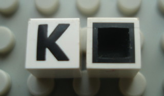 Modulex, Tile 1 x 1 with Black 'K' Pattern (with black lining on top and sides)