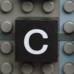 Modulex, Tile 2 x 2 (no Internal Supports) with White Lowercase Letter c Pattern