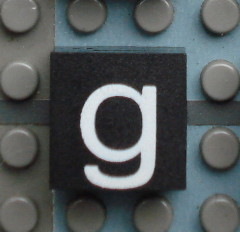Modulex, Tile 2 x 2 (no Internal Supports) with White Lowercase Letter g Pattern