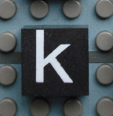 Modulex, Tile 2 x 2 (no Internal Supports) with White Lowercase Letter k Pattern