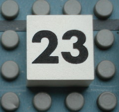 Modulex, Tile 2 x 2 (no Internal Supports) with Black Calendar Week Number 23 Pattern