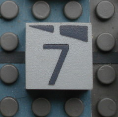 Modulex, Tile 2 x 2 (no Internal Supports) with Dark Gray Slopes and Calendar Week Number 7 Pattern