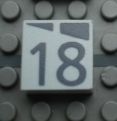 Modulex, Tile 2 x 2 (no Internal Supports) with Dark Gray Slopes and Calendar Week Number 18 Pattern