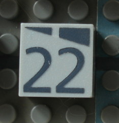 Modulex, Tile 2 x 2 (no Internal Supports) with Dark Gray Slopes and Calendar Week Number 22 Pattern