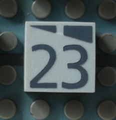 Modulex, Tile 2 x 2 (no Internal Supports) with Dark Gray Slopes and Calendar Week Number 23 Pattern