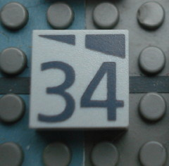 Modulex, Tile 2 x 2 (no Internal Supports) with Dark Gray Slopes and Calendar Week Number 34 Pattern