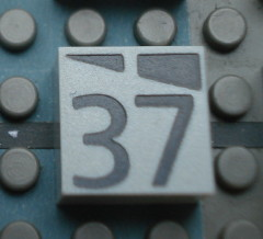 Modulex, Tile 2 x 2 (no Internal Supports) with Dark Gray Slopes and Calendar Week Number 37 Pattern