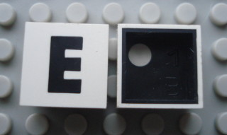 Modulex, Tile 2 x 2 with Black 'E' Pattern (Black internal lining with White dot)
