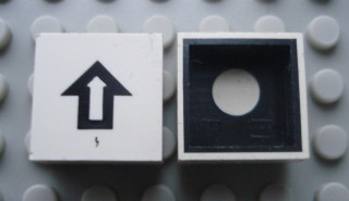 Modulex, Tile 2 x 2 with Black Arrow Pattern (Black internal lining with White dot)