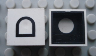 Modulex, Tile 2 x 2 with Black Symbol 'D' Pattern (Black internal lining with White dot)