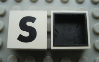 Modulex, Tile 2 x 2 with Black 'S' Pattern (Black internal lining no dot)