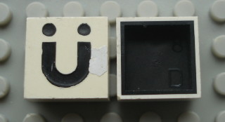 Modulex, Tile 2 x 2 with Black 'Ü' Pattern (Black internal lining no dot)