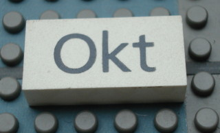 Modulex, Tile 2 x 4 with Dark Gray Month 'Okt' Pattern