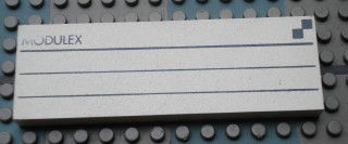 Modulex, Tile 4 x 12 with Dark Gray 'Modulex', Logo and Three Lines Pattern