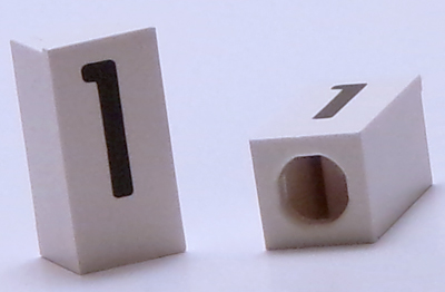 Tile, Modified 1 x 2 x 5/6 Stud Hole in End with Black Number 1 Pattern