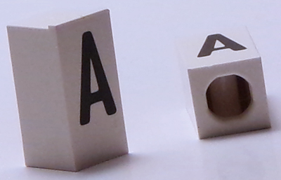 Tile, Modified 1 x 2 x 5/6 Stud Hole in End with Black Capital Letter A Pattern