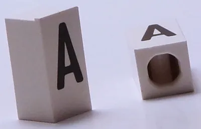 Tile, Modified 1 x 2 x 5/6 Stud Hole in End with Black Capital Letter A Pattern