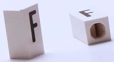 Tile, Modified 1 x 2 x 5/6 Stud Hole in End with Black Capital Letter F Pattern