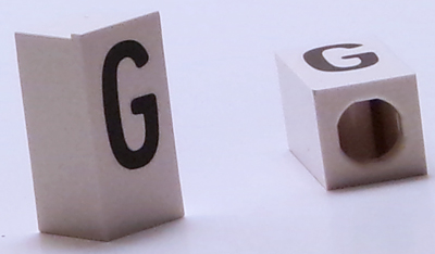 Tile, Modified 1 x 2 x 5/6 Stud Hole in End with Black Capital Letter G Pattern