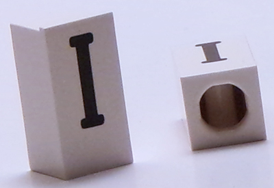 Tile, Modified 1 x 2 x 5/6 Stud Hole in End with Black Capital Letter I Pattern