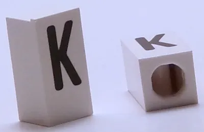 Tile, Modified 1 x 2 x 5/6 Stud Hole in End with Black Capital Letter K Pattern