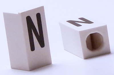 Tile, Modified 1 x 2 x 5/6 Stud Hole in End with Black Capital Letter N Pattern