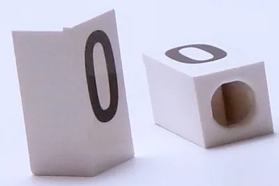 Tile, Modified 1 x 2 x 5/6 Stud Hole in End with Black Capital Letter O Pattern