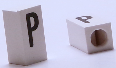 Tile, Modified 1 x 2 x 5/6 Stud Hole in End with Black Capital Letter P Pattern