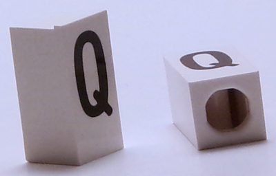 Tile, Modified 1 x 2 x 5/6 Stud Hole in End with Black Capital Letter Q Pattern