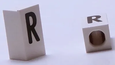 Tile, Modified 1 x 2 x 5/6 Stud Hole in End with Black Capital Letter R Pattern