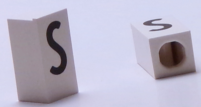 Tile, Modified 1 x 2 x 5/6 Stud Hole in End with Black Capital Letter S Pattern